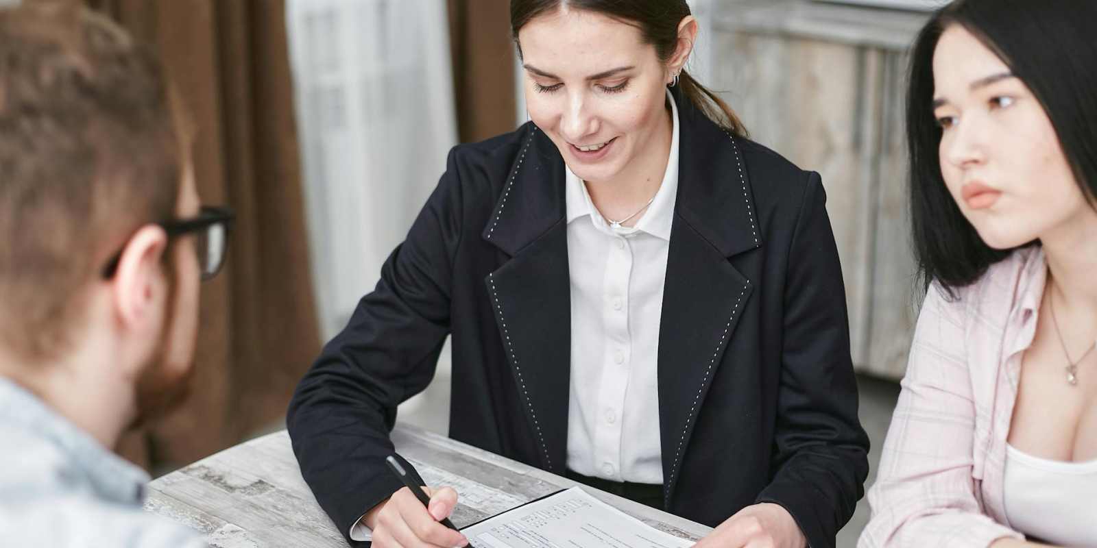 Agent Explaining Insurance Policy to Shop Owners