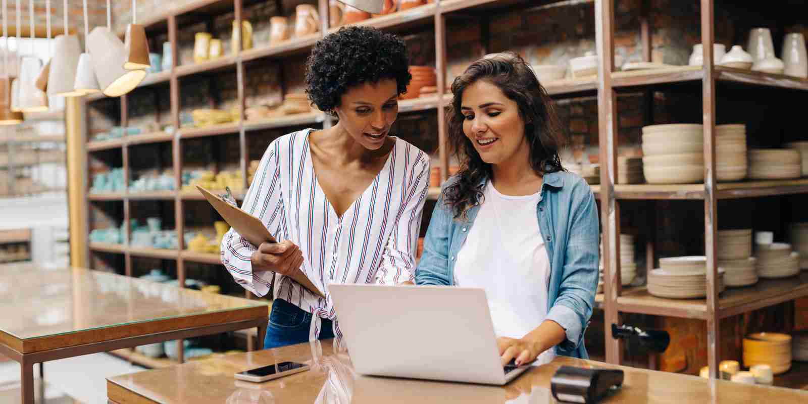 Young Retail Business Owners Checking Insurance Regulations