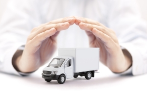 Hand Protecting Delivery Van Representing Commercial Auto Insurance Concept