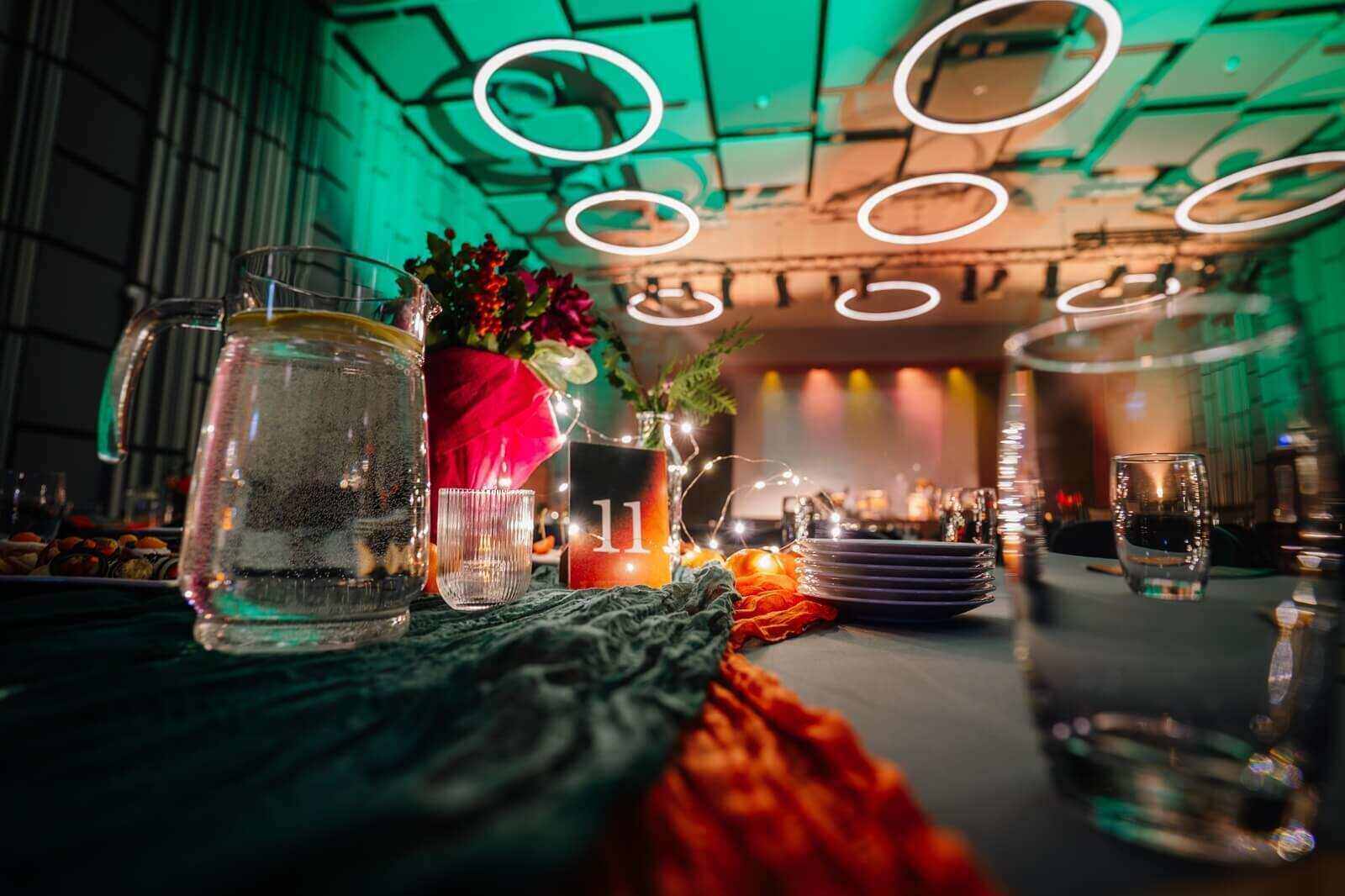 elegant dining setup featuring a beautifully arranged table with floral centerpiece