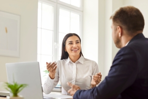 Female Insurance Agent Explaining Benefits of Employee Training to Retail Business Owner