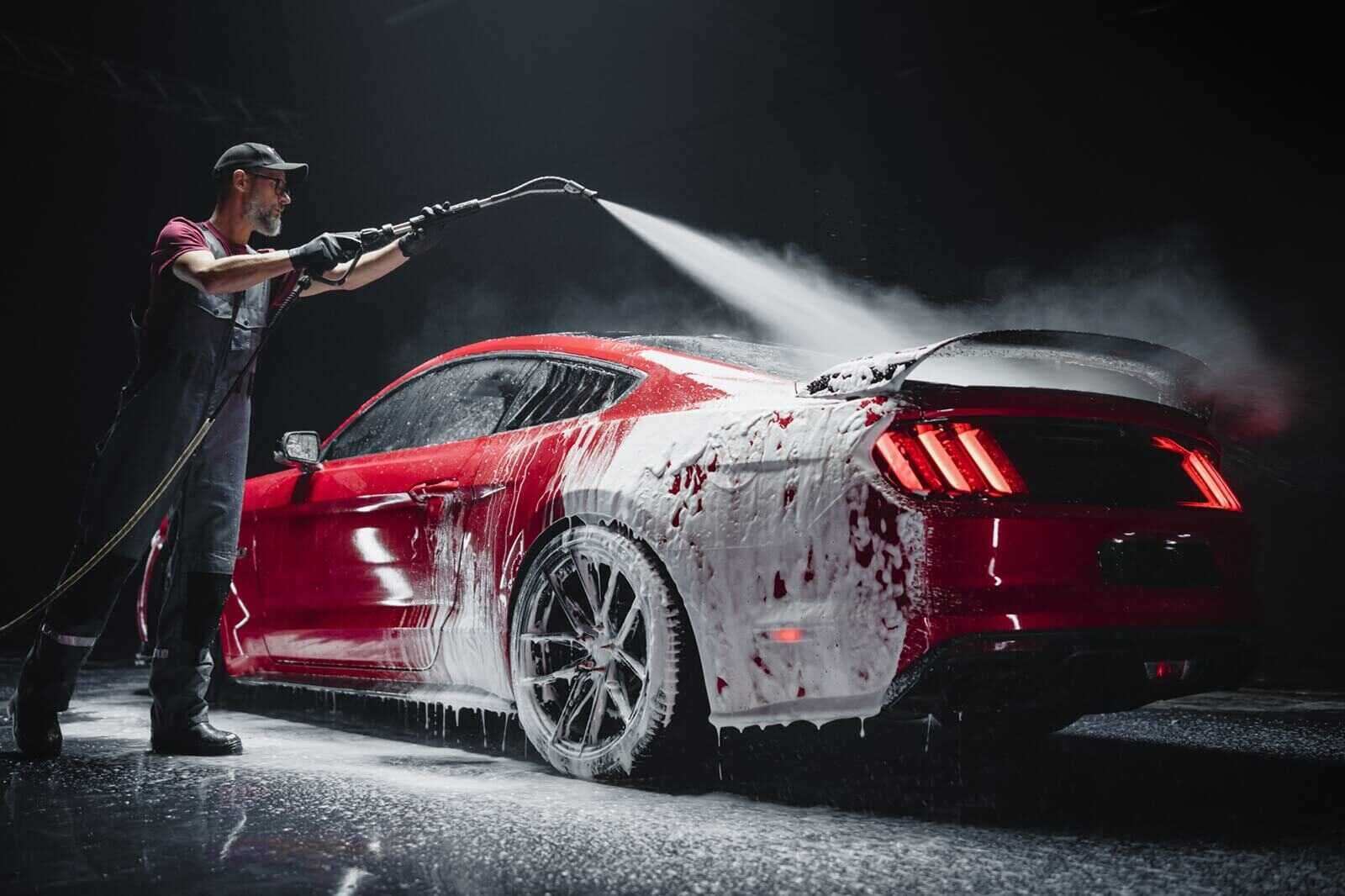red performance car getting care and treatment