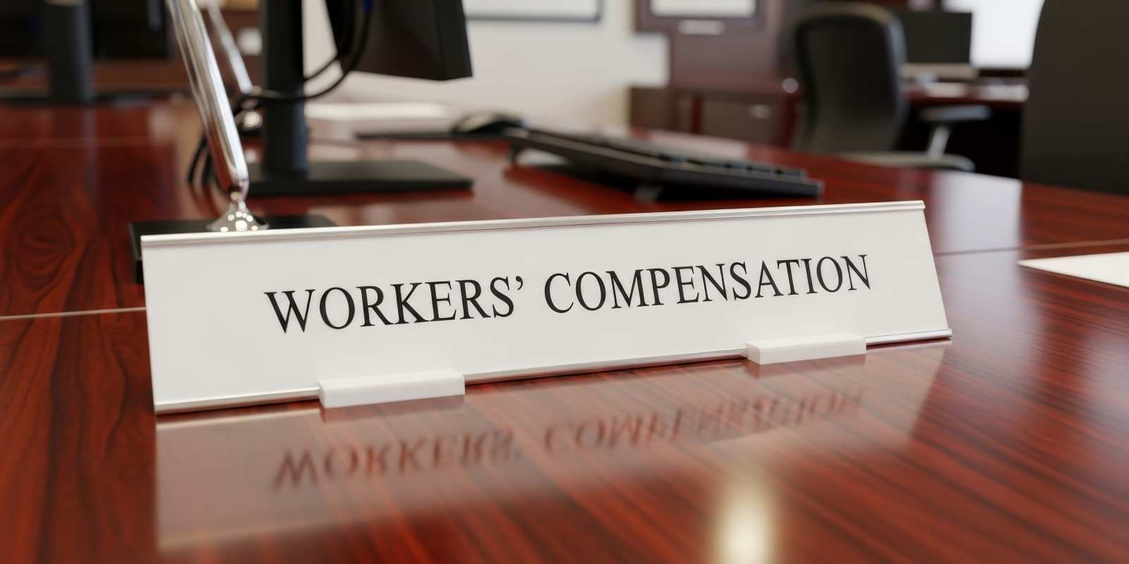 Workers Compensation Signage on A Desk in an Office