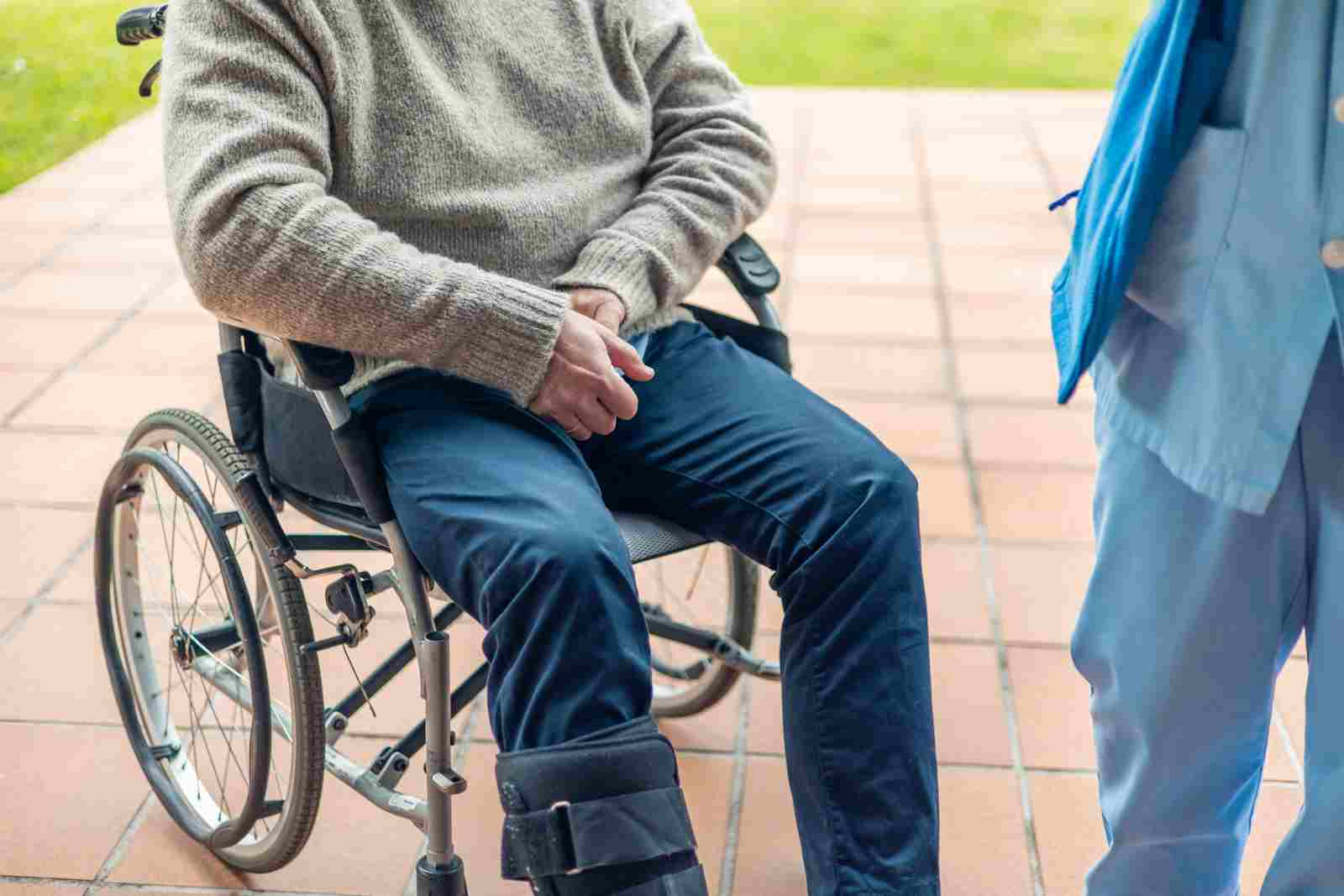Nurse assisting man with short-term disability insurance
