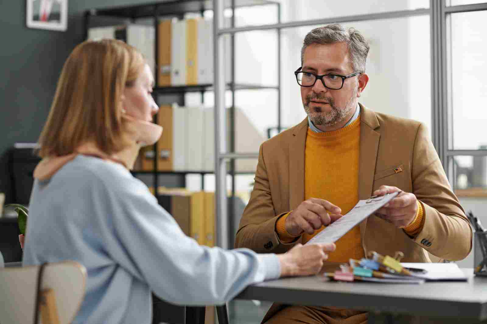 Insurance agent talking to client about short-term disability insurance