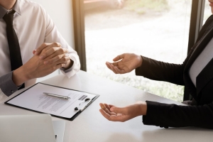 Insurance Agent Explaining Class Codes for Workers Compensation to Freight Business Owner
