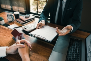 Insurance Agent Explaining Policy Features to Retail Business Owner