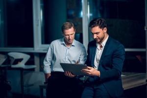 Agent Showing Insurance Policy to Online Retail Store Owner
