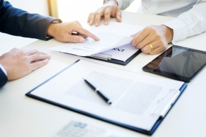 Businessman Discussing Strategy to Reduce Workers Compensation Insurance Cost