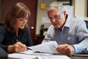 Female Insurance Agent Helping CT Contractor Optimize Policy for Premium Cost Reduction