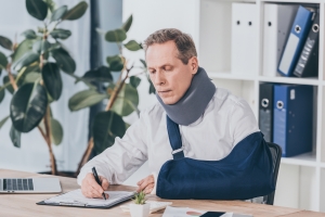 Injured Fleet Employee Filling Workers Compensation Insurance Claim Form
