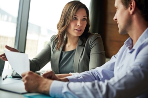 Insurance Agent Explaining Workers Compensation Policy to Fleet Owner