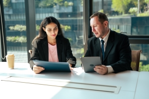 Business Professionals Checking Workers Compensation Insurance Rate Gap Between Industries