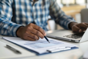 Businessman Reviewing Loss Runs for Experience Mod Calculation