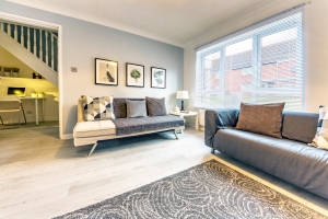 Newly Renovated House Living Room with Two Decorated Sofa Sets