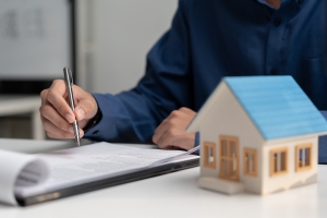 Agent Doing Renewal Paperwork for Homeowners Insurance