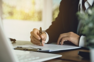 Car Wash Business Owner Reading Legal Liability Terms for Car Wash Faults