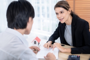 Man Asking Questions to Female Homeowners Insurance Agent